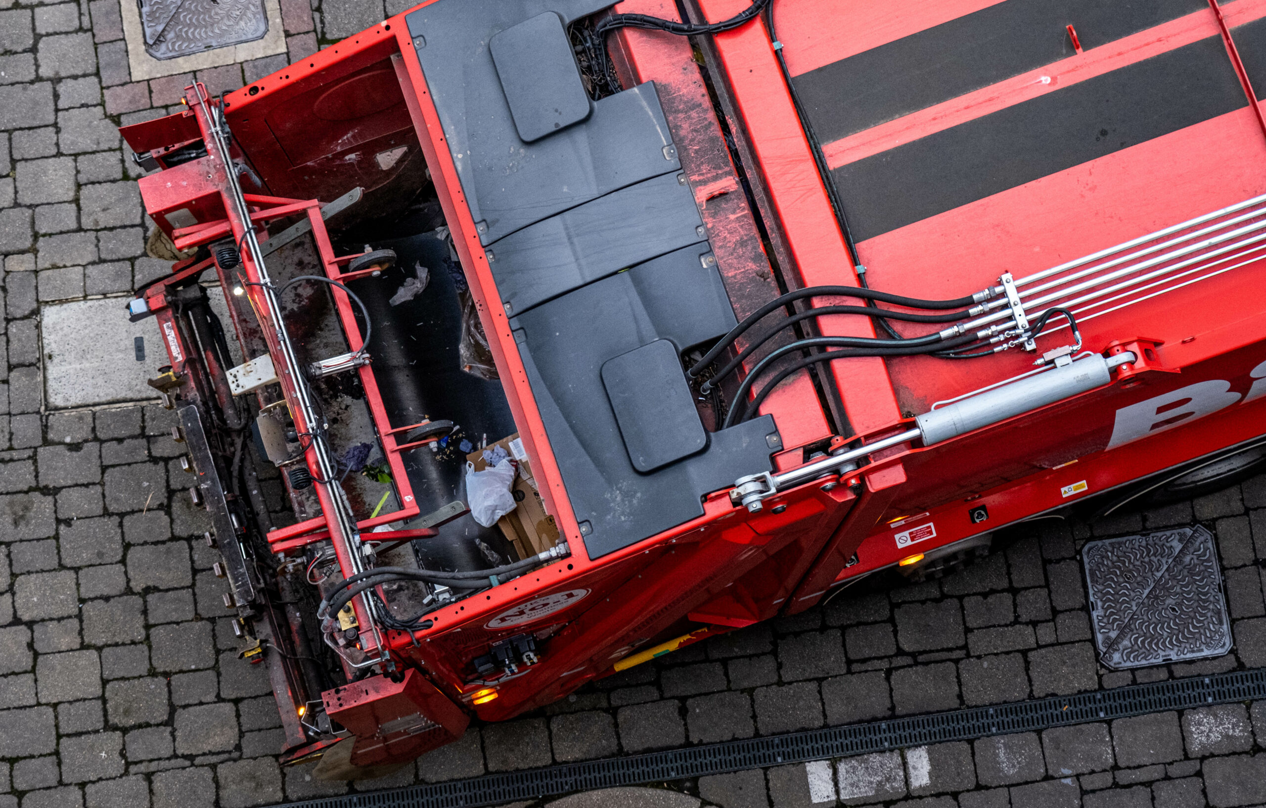 Red Refuse Truck Or Lorry Collecting Commercial Waste