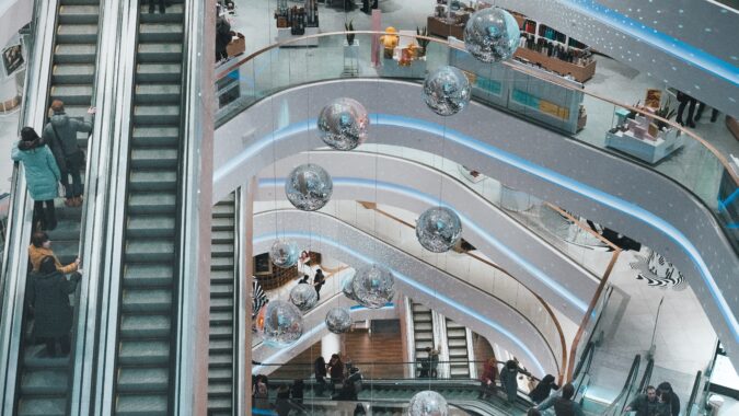 overhead view of escalators in shopping mall.