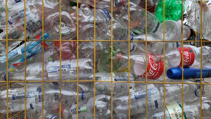 plastic in cage at a materials recovery facility.