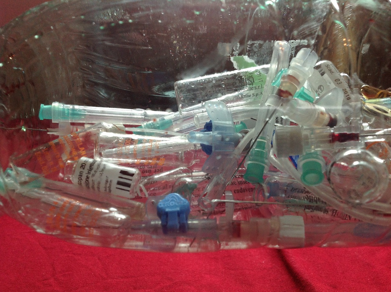 medical waste bucket of syringes.