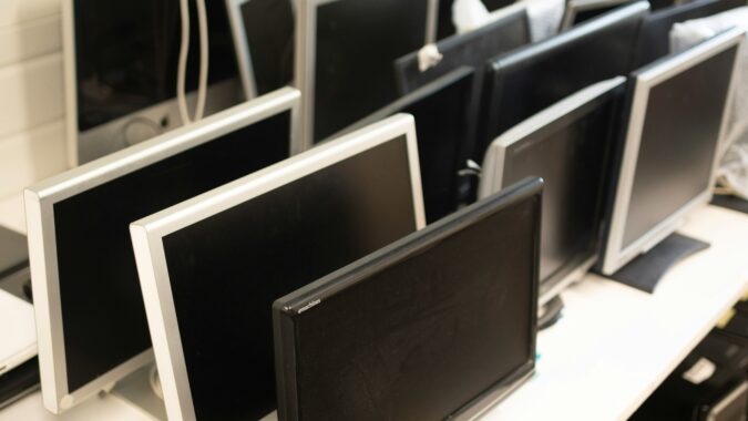 waste computer monitors waiting for recycling.